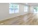 Living room featuring large windows that provide ample natural light and vinyl flooring at 4129 Cornelius Ave, Indianapolis, IN 46208