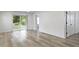 Living room showcasing sliding glass doors and wood-look flooring at 4129 Cornelius Ave, Indianapolis, IN 46208
