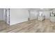 Spacious living room leads to the kitchen, featuring an open floor plan and vinyl flooring at 4129 Cornelius Ave, Indianapolis, IN 46208
