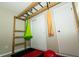 Finished basement with pull up bar, gymnastic rings, yoga hammock and ladder at 431 N Bauman St, Indianapolis, IN 46214