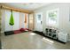 Finished basement with pull up bar, gymnastic rings, yoga hammock and mats on a durable tile floor at 431 N Bauman St, Indianapolis, IN 46214