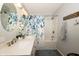Bright bathroom featuring double vanity, subway tile, and decorative shower curtain at 431 N Bauman St, Indianapolis, IN 46214