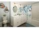 Bright bathroom with a double vanity, stylish mirrors and subway tile at 431 N Bauman St, Indianapolis, IN 46214