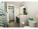 Bathroom vanity featuring a unique round window and granite countertops at 431 N Bauman St, Indianapolis, IN 46214