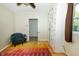 Bedroom with colorful area rug and built in cabinet at 431 N Bauman St, Indianapolis, IN 46214