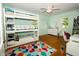 Bright bedroom with hardwood floors, bunk beds, and ceiling fan at 431 N Bauman St, Indianapolis, IN 46214