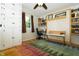 Bedroom with built in bookshelves, hardwood floors, and desk at 431 N Bauman St, Indianapolis, IN 46214