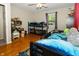bedroom with bunk beds, hardwood floors and bright sunlight at 431 N Bauman St, Indianapolis, IN 46214