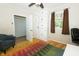 Bedroom with hardwood floors, area rug and built in cabinet at 431 N Bauman St, Indianapolis, IN 46214