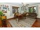 Cozy dining room with beautiful wood floors and plenty of natural light at 431 N Bauman St, Indianapolis, IN 46214