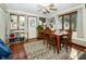Dining room has hardwood floors, a ceiling fan, and natural light at 431 N Bauman St, Indianapolis, IN 46214