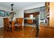 Dining room with wood floors and an adjacent kitchen at 431 N Bauman St, Indianapolis, IN 46214