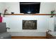 Cozy fireplace in living room with white brick and hearth at 431 N Bauman St, Indianapolis, IN 46214