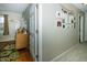 Hallway leading to a bedroom with hardwood floors and an adjoining doorway at 431 N Bauman St, Indianapolis, IN 46214