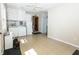 Laundry room with washer, dryer, cabinets and access to other rooms at 431 N Bauman St, Indianapolis, IN 46214