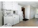 Spacious laundry room features a washer and dryer with plenty of cabinet space at 431 N Bauman St, Indianapolis, IN 46214