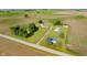 Beautiful aerial view of a home with a large yard, mature trees and outbuildings at 4330 S 100 E, Lebanon, IN 46052
