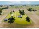 Lovely aerial view of a rural home with outbuildings, surrounded by the peace of farmland at 4330 S 100 E, Lebanon, IN 46052