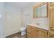 Clean bathroom featuring a tub/shower combo and a classic wooden vanity at 4330 S 100 E, Lebanon, IN 46052