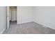 A bright bedroom featuring neutral paint, soft carpet flooring and a door, perfect for rest and relaxation at 4330 S 100 E, Lebanon, IN 46052