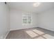 Cozy bedroom with plush carpeting and a large window offering natural light at 4330 S 100 E, Lebanon, IN 46052