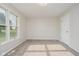 Well-lit bedroom with large windows, neutral walls, and plush carpeting at 4330 S 100 E, Lebanon, IN 46052
