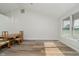 Dining room with wood floors, chandelier, large window, and vaulted ceilings at 4330 S 100 E, Lebanon, IN 46052