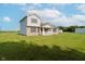 Two-story home with a brick facade, vinyl siding, and large lawn area at 4330 S 100 E, Lebanon, IN 46052