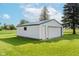 A white garage features ample lawn space creating an attractive exterior that enhances its functionality at 4330 S 100 E, Lebanon, IN 46052