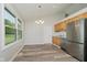 Well-lit kitchen with stainless steel appliances, wood cabinets, and wood floors at 4330 S 100 E, Lebanon, IN 46052