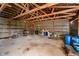 Inside a large outbuilding, metal walls frame ample open space that is ideal for a variety of uses at 4330 S 100 E, Lebanon, IN 46052