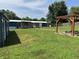 Expansive backyard with a wooden deck, pergola, lush green grass, manicured path, and a beautiful home exterior at 4466 Buffalo Ln, Martinsville, IN 46151