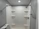 Bathroom featuring new shower and fixtures with coordinating wall paint and base trim at 4466 Buffalo Ln, Martinsville, IN 46151
