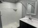 Bathroom with a newly tiled white shower and a modern sink at 4466 Buffalo Ln, Martinsville, IN 46151