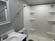 Bathroom featuring shower, vanity, and new fixtures with coordinating wall paint and base trim at 4466 Buffalo Ln, Martinsville, IN 46151