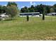 Beautiful home exterior with a spacious front yard, green grass, well-maintained lawn, and a driveway at 4466 Buffalo Ln, Martinsville, IN 46151