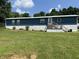 Charming home with a blue exterior, inviting entrance, and a lush green lawn at 4466 Buffalo Ln, Martinsville, IN 46151