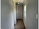 Hallway featuring coordinating wall paint and base trim and new flooring and a window at 4466 Buffalo Ln, Martinsville, IN 46151