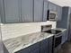 Modern kitchen with sleek countertops, stainless steel appliances, and ample storage at 4466 Buffalo Ln, Martinsville, IN 46151