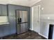 Modern kitchen boasting stainless steel refrigerator and sleek cabinetry at 4466 Buffalo Ln, Martinsville, IN 46151