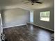 Inviting living room featuring elegant flooring, neutral walls, and a bright window at 4466 Buffalo Ln, Martinsville, IN 46151
