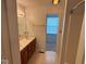 Bathroom with a double sink vanity, providing ample counter space and linoleum flooring at 4912 Atlanta St, Anderson, IN 46013