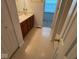 Bathroom with a double sink vanity and linoleum flooring, offering both functionality and easy maintenance at 4912 Atlanta St, Anderson, IN 46013