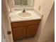 Bathroom sink with natural wood cabinets at 4912 Atlanta St, Anderson, IN 46013
