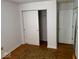 Bedroom with a sliding closet and neutral wood flooring, maximizing space and style at 4912 Atlanta St, Anderson, IN 46013
