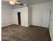 Spacious bedroom with neutral carpeting, ceiling fan, and convenient access to an attached closet at 4912 Atlanta St, Anderson, IN 46013
