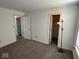 This is a bedroom with neutral carpeting and white walls, providing a blank canvas for personalization at 4912 Atlanta St, Anderson, IN 46013