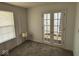 Bedroom featuring a lamp and charming double doors, providing an inviting space at 4912 Atlanta St, Anderson, IN 46013