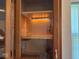 Lit glass door cabinetry with natural wood trim at 4912 Atlanta St, Anderson, IN 46013