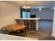 A dining area open to living room with a table, chairs, and bar seating at 4912 Atlanta St, Anderson, IN 46013